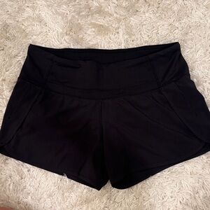 lululemon Black Speed Up Shorts - 4 inch low rise with reflective zipper